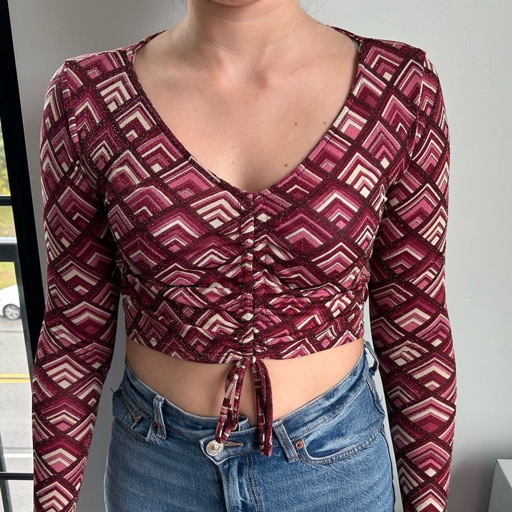Pink and maroon patterned long sleeve crop top